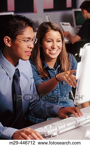 High school friends using computer View Large Photo Image Stock Image - High school friends using computer. Fotosearch