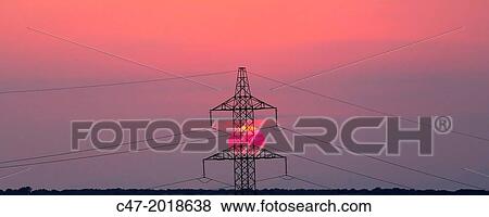 High Voltage electricity transmission tower, electricity pylon, at sunset taken near Sanahuja on the la Segarra area, Lleida province, Catalonia, Spain View Large Photo Image Stock Photo - High Voltage electricity transmission tower, electricity pylon, at sunset taken near Sanahuja on the la Segarra area, Lleida province, Catalonia, Spain. Fotosearch