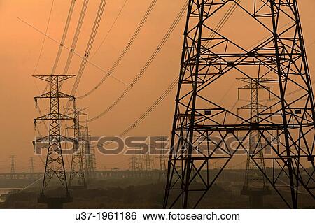 High voltage towers along the Taiwan highway at dusk. View Large Photo Image Stock Photograph - High voltage towers along the Taiwan highway at dusk.. Fotosearch
