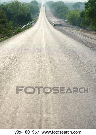 Stock Photo - Highway 70, a ride on the long open road across the desert at sunset On route to San Luis Potosi. Fotosearch