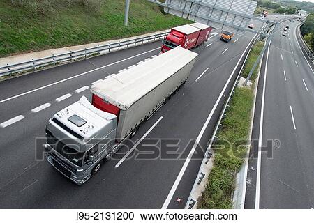 Stock Image - Highway viewed from above bridge, Gelida, Spain.. Fotosearch