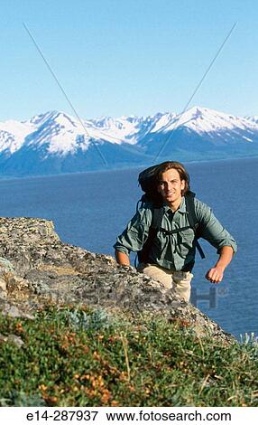 Stock Photo - Hiker along Turnagain Arm in summer. Chugach State Park. Alaska. Fotosearch