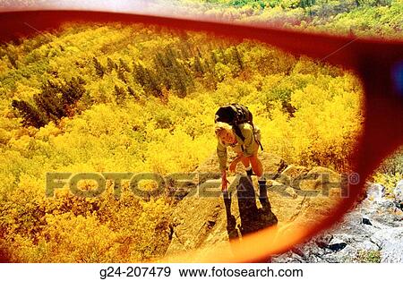 Hiker and autumn colors, view thru lens of sunglasses View Large Photo Image Stock Photo - Hiker and autumn colors, view thru lens of sunglasses. Fotosearch