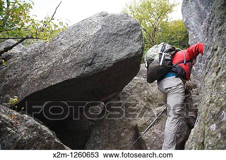Hiker ascending King Ravine Trail Located in King Ravine in the White Mountains, New Hampshire USA View Large Photo Image Stock Image - Hiker ascending King Ravine Trail Located in King Ravine in the White Mountains, New Hampshire USA. Fotosearch