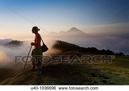 Stock Photograph - Hiker at sunset. Fotosearch