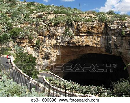 Hiker at the Natural Entrance to Carlsbad Caverns, Carlsbad Caverns National Park, New Mexico, USA View Large Photo Image Stock Photograph - Hiker at the Natural Entrance to Carlsbad Caverns, Carlsbad Caverns National Park, New Mexico, USA. Fotosearch