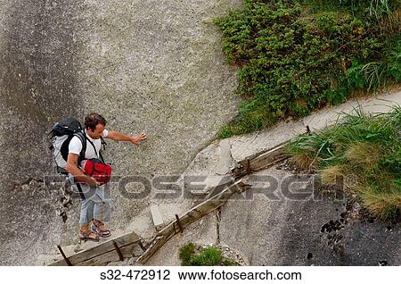Stock Image - Hiker. Cavallers. Vall de Boh?. Pyrenees. Lleida province. Spain.. Fotosearch