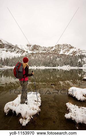 Hiker enjoying the view of Sawtooth montains with the reflection in Phyllis lake, Idaho View Large Photo Image Stock Image - Hiker enjoying the view of Sawtooth montains with the reflection in Phyllis lake, Idaho. Fotosearch