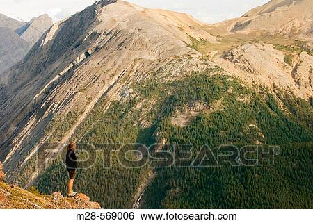 Hiker gazing at views from Parker Ridge, Banff National Park. Canada View Large Photo Image Stock Photograph - Hiker gazing at views from Parker Ridge, Banff National Park. Canada. Fotosearch
