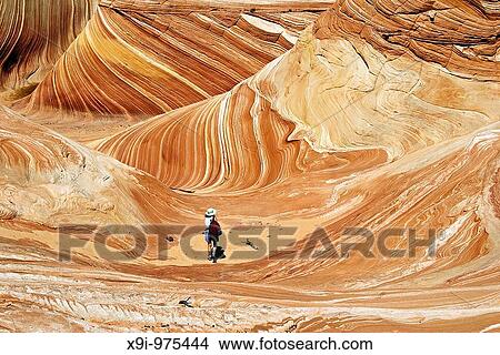 Hiker in The Wave, Paria Canyon-Vermillion Cliffs Wilderness, Arizona View Large Photo Image Picture - Hiker in The Wave, Paria Canyon-Vermillion Cliffs Wilderness, Arizona. Fotosearch