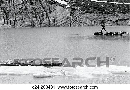 Hiker jumping at glacial lake. Jasper NP. Alberta. Canada View Large Photo Image Stock Image - Hiker jumping at glacial lake. Jasper NP. Alberta. Canada. Fotosearch