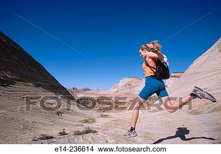 Hiker jumping. Zion National Park. Utah. USA View Large Photo Image Picture - Hiker jumping. Zion National Park. Utah. USA. Fotosearch