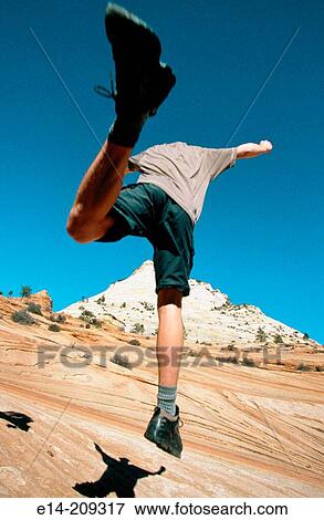 Hiker jumping. Zion National Park. Utah. USA View Large Photo Image Stock Photo - Hiker jumping. Zion National Park. Utah. USA. Fotosearch