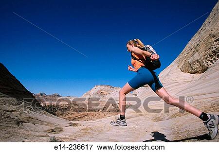 Hiker jumping. Zion National Park. Utah. USA View Large Photo Image Stock Photo - Hiker jumping. Zion National Park. Utah. USA. Fotosearch