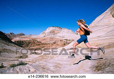 Hiker jumping. Zion National Park. Utah. USA View Large Photo Image Stock Photograph - Hiker jumping. Zion National Park. Utah. USA. Fotosearch