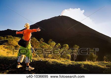 Hiker looking at Pacaya Volcano View Large Photo Image Stock Photography - Hiker looking at Pacaya Volcano. Fotosearch