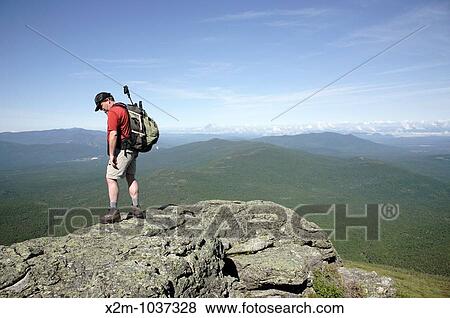 Stock Photo - Hiker on Caps Ridge Trail in the White Mountains, New Hampshire USA. Fotosearch