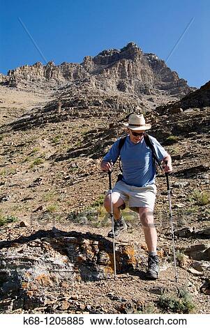 Stock Photography - hiker on Mount Galwey, Waterton National Park, Alberta, Canada. Fotosearch