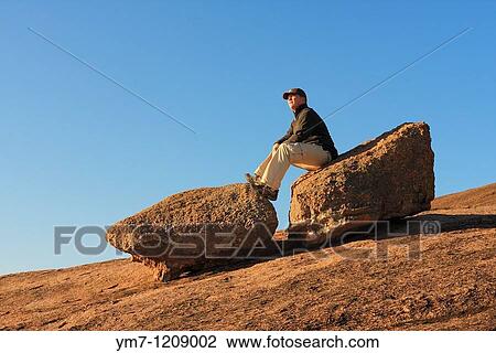 Hiker on Rock - Enchanted Rock SNA, Texas View Large Photo Image Stock Image - Hiker on Rock - Enchanted Rock SNA, Texas. Fotosearch