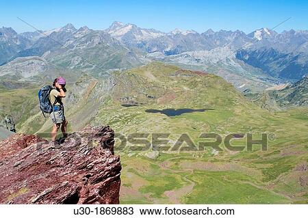 Stock Image - Hiker on the summit of Anayet, an old volcano in Tena valley Formigal Sallent de GBllego Pyrenees Huesca province Arag? n Spain. Fotosearch