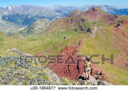 Stock Photo - Hiker on the summit of Anayet, an old volcano in Tena valley Formigal Sallent de GBllego Pyrenees Huesca province Arag? n Spain. Fotosearch