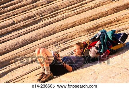 Hiker resting and writing at Snow Canyon State Park. Utah. USA View Large Photo Image Stock Photography - Hiker resting and writing at Snow Canyon State Park. Utah. USA. Fotosearch