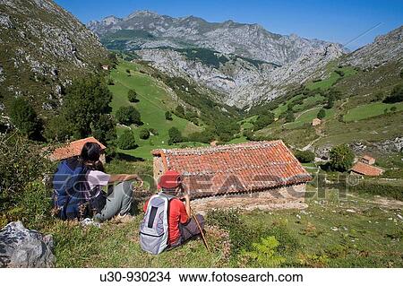 Hiker resting in the Invernales de Panizales, of the small town of Bejes, in the municipality of Cillorigo de Li? bana, in Cantabria, Spain View Large Photo Image Picture - Hiker resting in the Invernales de Panizales, of the small town of Bejes, in the municipality of Cillorigo de Li? bana, in Cantabria, Spain. Fotosearch