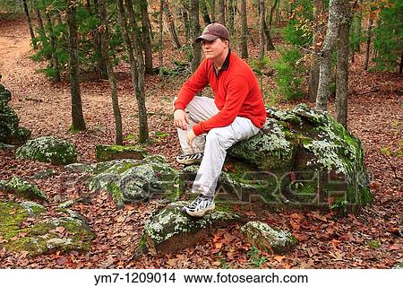 Hiker Resting on Rocky Outcropping - Bastrop State Park, Texas View Large Photo Image Picture - Hiker Resting on Rocky Outcropping - Bastrop State Park, Texas. Fotosearch