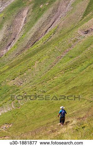 Hiker walking down from Bisaur? n peak 2 676 m Arag? es valley Arag? es del Puerto, Arag? n Spain View Large Photo Image Stock Photo - Hiker walking down from Bisaur? n peak 2 676 m Arag? es valley Arag? es del Puerto, Arag? n Spain. Fotosearch