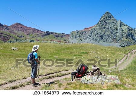 Hiker walking to Anayet peak, an old volcano in Tena valley Formigal Sallent de GBllego Pyrenees Huesca province Arag? n Spain View Large Photo Image Stock Image - Hiker walking to Anayet peak, an old volcano in Tena valley Formigal Sallent de GBllego Pyrenees Huesca province Arag? n Spain. Fotosearch