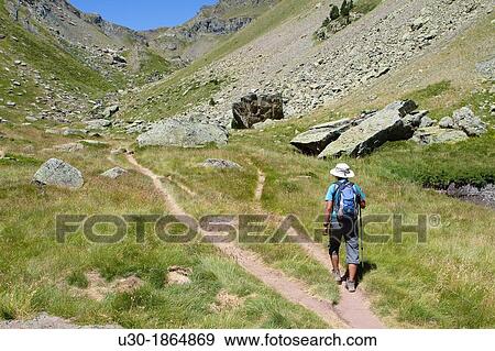 Hiker walking to Anayet peak, in Tena valley Formigal Sallent de GBllego Pyrenees Huesca province Arag? n Spain View Large Photo Image Stock Photo - Hiker walking to Anayet peak, in Tena valley Formigal Sallent de GBllego Pyrenees Huesca province Arag? n Spain. Fotosearch