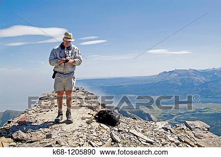 hiker with a camera on Mount Galwey, Waterton National Park, Alberta, Canada View Large Photo Image Stock Image - hiker with a camera on Mount Galwey, Waterton National Park, Alberta, Canada. Fotosearch