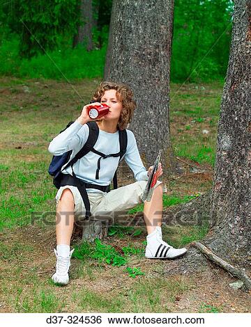 Stock Photograph - Hiker woman resting. Fotosearch