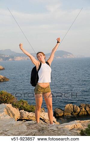 Hiker woman satisfied in the cliff View Large Photo Image Stock Photo - Hiker woman satisfied in the cliff. Fotosearch