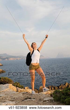 Hiker woman satisfied in the cliff View Large Photo Image Stock Photo - Hiker woman satisfied in the cliff. Fotosearch