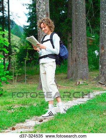 Hiker woman with map View Large Photo Image Stock Photography - Hiker woman with map. Fotosearch