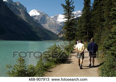 hikers at Lake Louise, Banff National Park, Alberta, Canada View Large Photo Image Stock Image - hikers at Lake Louise, Banff National Park, Alberta, Canada. Fotosearch