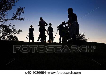 Hikers at sunset View Large Photo Image Picture - Hikers at sunset. Fotosearch
