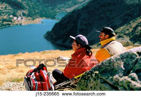 Hikers contemplating the landscape in Neouvielle Natural Park. French Pyrenees. View Large Photo Image Stock Photography - Hikers contemplating the landscape in Neouvielle Natural Park. French Pyrenees.. Fotosearch