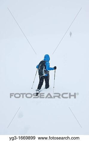 Hikers descend Fan Brycheiniog in whiteout winter conditions, Black Mountain, Brecon Beacons naitonal park, Wales View Large Photo Image Stock Photo - Hikers descend Fan Brycheiniog in whiteout winter conditions, Black Mountain, Brecon Beacons naitonal park, Wales. Fotosearch