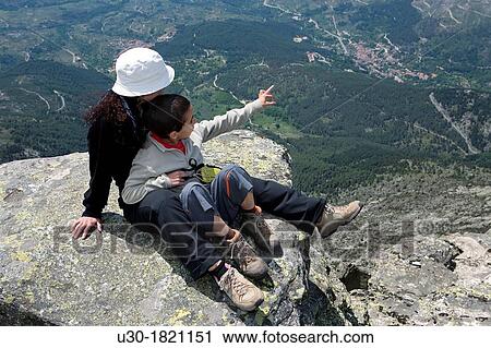 Stock Image - Hikers in Torozo summit Sierra de Gredos? vila province Castilla y Le? n Spain. Fotosearch