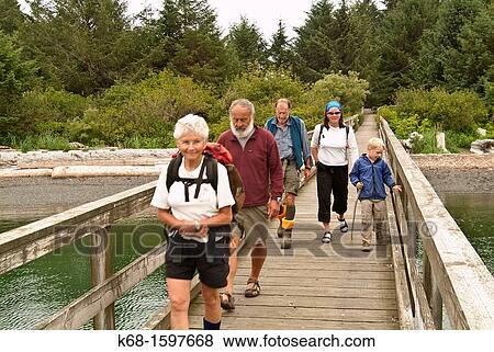 Stock Photo - hikers on Nootka Island, BC, Canada. Fotosearch