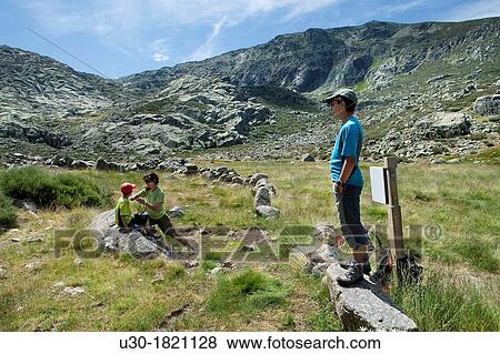 Stock Photo - Hikers restiing in Navamediana Valley, Sierra de Gredos Regional Park? vila province Castilla y Le? n Spain. Fotosearch
