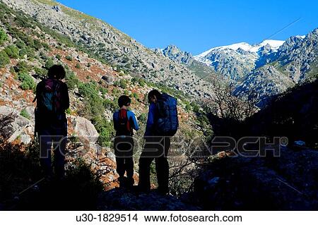Picture - Hikers walking along Tejea Valley in Sierra de Gredos Regional Park Candeleda? vila province Castilla y Le? n Spain. Fotosearch