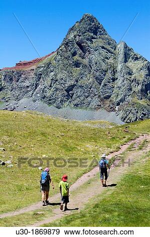 Hikers walking to Anayet peak, an old volcano in Tena valley Formigal Sallent de GBllego Pyrenees Huesca province Arag? n Spain View Large Photo Image Stock Photo - Hikers walking to Anayet peak, an old volcano in Tena valley Formigal Sallent de GBllego Pyrenees Huesca province Arag? n Spain. Fotosearch
