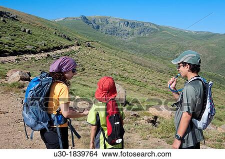Picture - Hikers walking to Pea Negra cirque in Sierra de B? jar Natural Park Becedas? vila province Castilla y Le? n Spain. Fotosearch