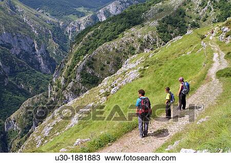 Hikers walking up to Tresviso, a small village in Picos de Europa National Park by historic Urd? n path from La Hermida Gorges Pearrubia Cantabria, Spain View Large Photo Image Stock Image - Hikers walking up to Tresviso, a small village in Picos de Europa National Park by historic Urd? n path from La Hermida Gorges Pearrubia Cantabria, Spain. Fotosearch
