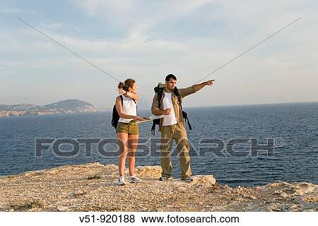 Hikers with problems in the cliff View Large Photo Image Stock Photo - Hikers with problems in the cliff. Fotosearch