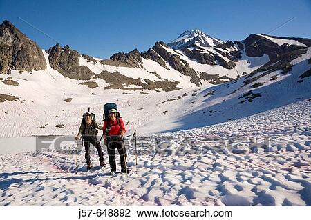 Hiking and climbing in Glacier Peak Wilderness. Washington USA. Hiking out of high camp after a succesful summit. Early morning light. View Large Photo Image Stock Image - Hiking and climbing in Glacier Peak Wilderness. Washington USA. Hiking out of high camp after a succesful summit. Early morning light.. Fotosearch