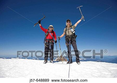 Stock Photo - Hiking and climbing in Glacier peak wilderness Washington USA. Summit shot on the top of glacier peak. Victory.. Fotosearch